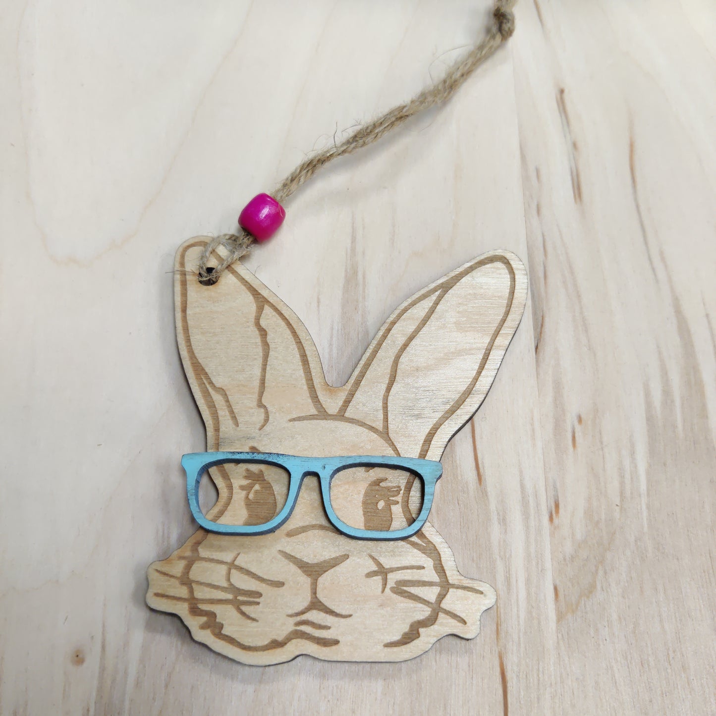 Wooden bunny with blue glasses ornament